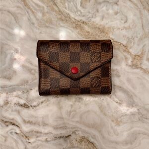 Louis Vuitton Brown Checkered Wallet with Red Button.